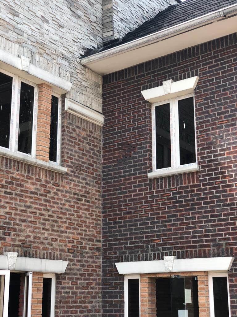 Office Building With Cobble Cultured Stones and Brick Tiles